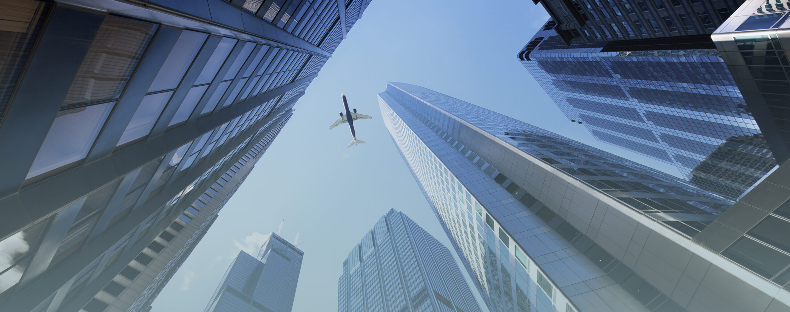 skyscraper with airplane flying overhead 1