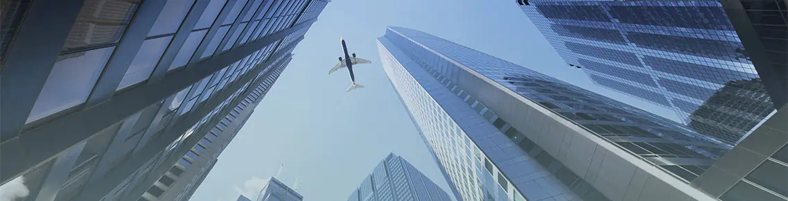 skyscraper with airplane flying overhead 1
